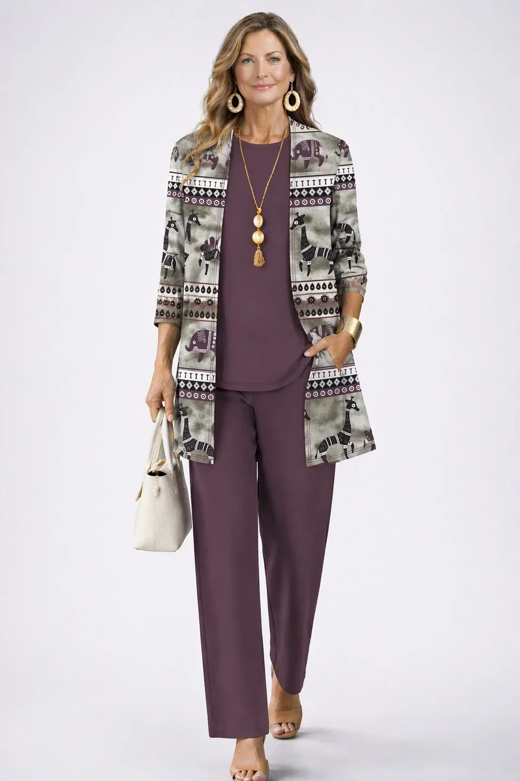 Octavia plum three-piece set with grey safari-print open cardigan featuring giraffes and elephants, plain plum top and wide-leg trousers