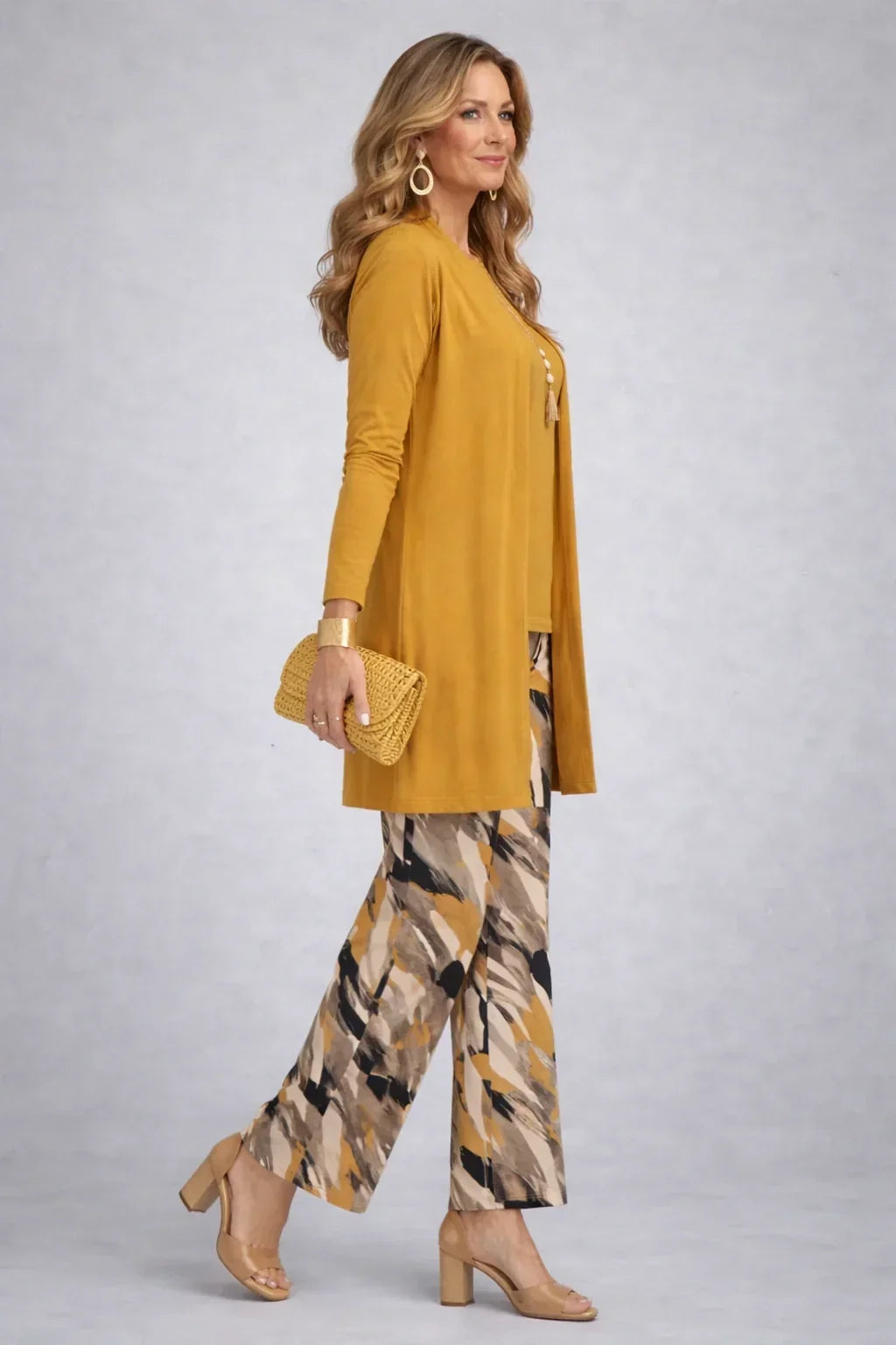 Honora mustard three-piece set side view showing the long open cardigan and printed wide-leg trousers