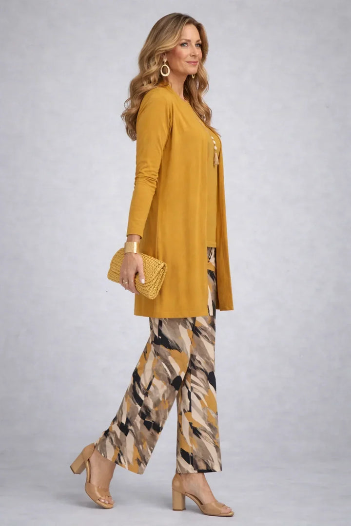 Honora mustard three-piece set side view showing the long open cardigan and printed wide-leg trousers