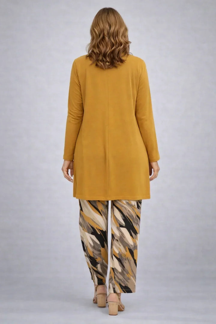 Honora mustard three-piece set back view with the long cardigan and mustard, cream and black print trousers