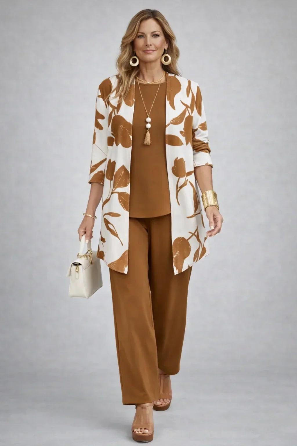 Henrietta caramel three-piece set with cream leaf-print open cardigan, plain caramel top and wide-leg trousers, front view