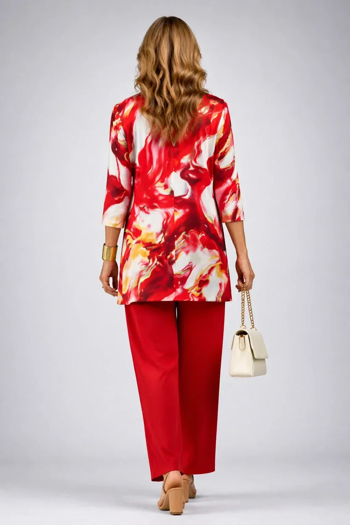 Theodora red swirl-print three-piece set back view showing the long printed cardigan and red trousers