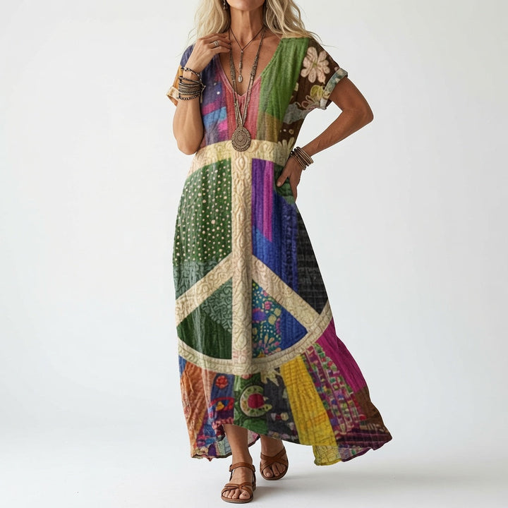 Elisoria flowing V-neck midi dress in a multicolour patchwork print with peace sign
