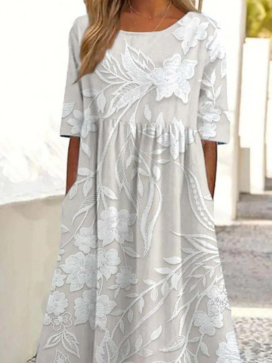 Delilah midi dress close-up of the white floral and leaf print and gathered bodice