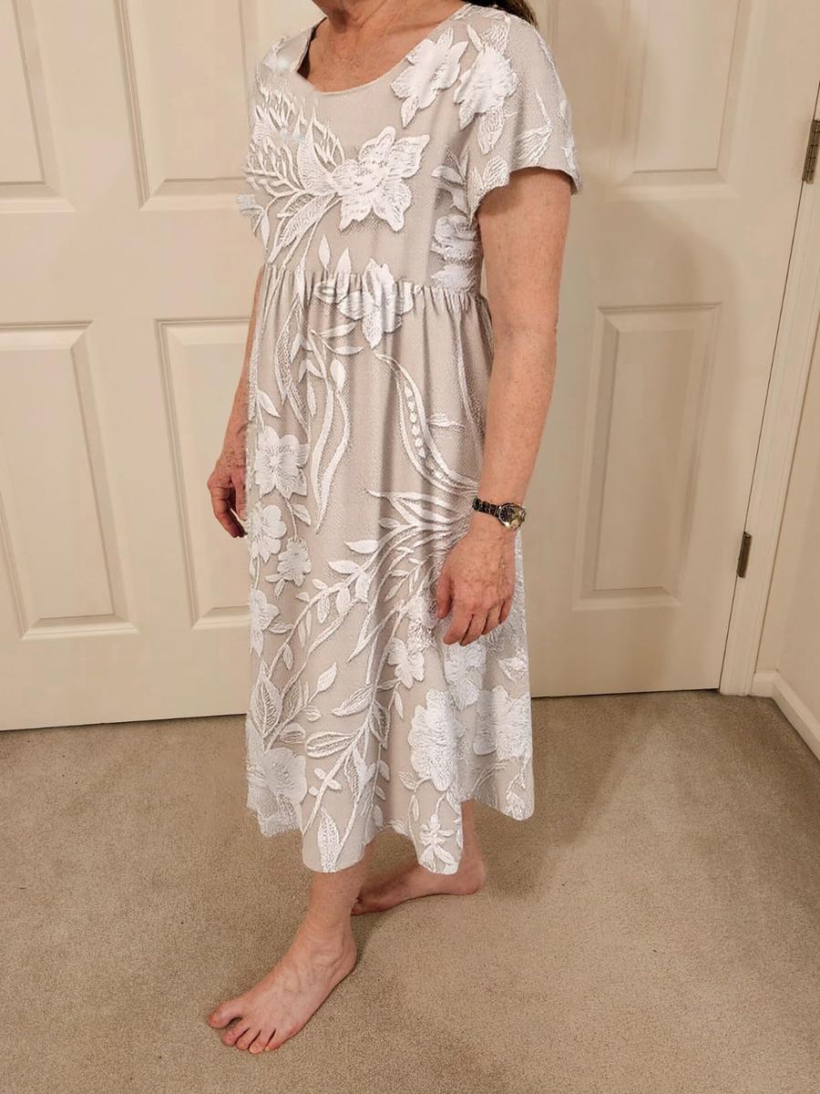 Delilah grey floral short-sleeve midi dress worn with bare feet, side view