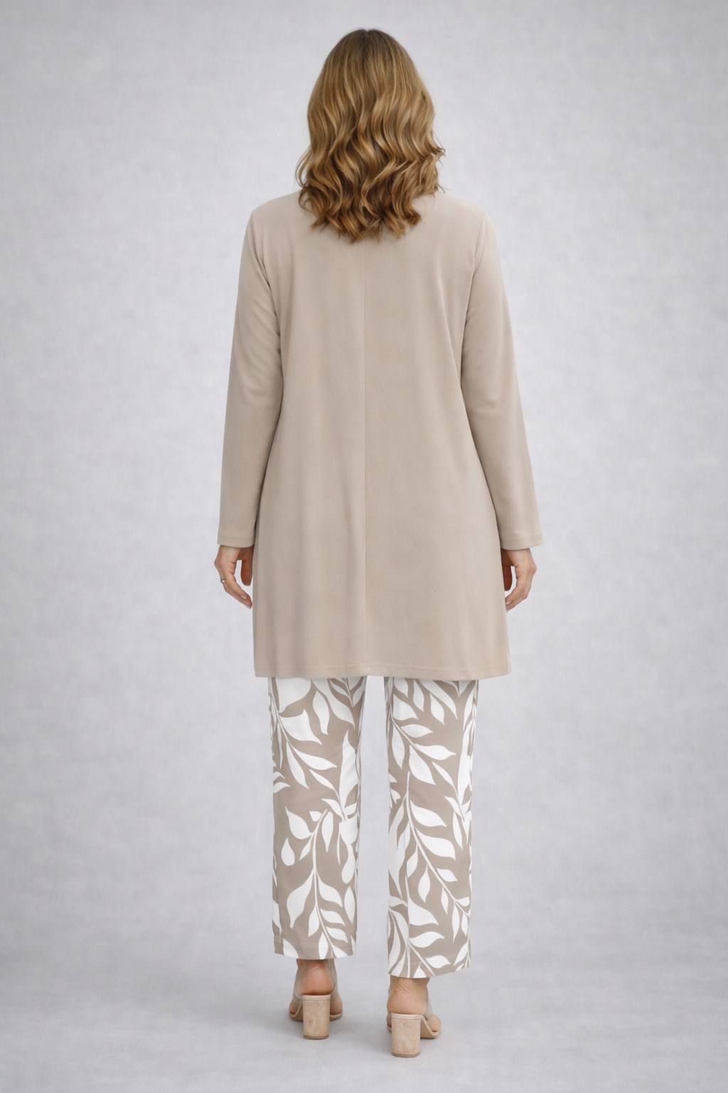 Sylvia taupe longline cardigan with white and taupe leaf-print trousers, back view