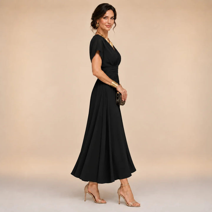 Bettina wrap-style V-neck midi dress in black, side view