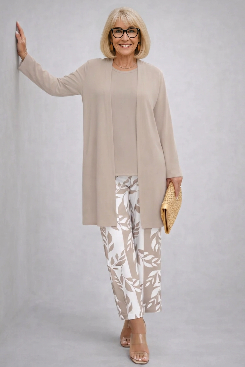 Sylvia taupe three-piece set with longline open cardigan, matching round-neck top and white leaf-print straight-leg trousers, front view