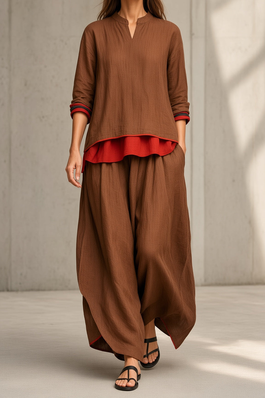 Tamsin two-piece set in brown with notched-neck tunic, red layered hem and wide-leg pants