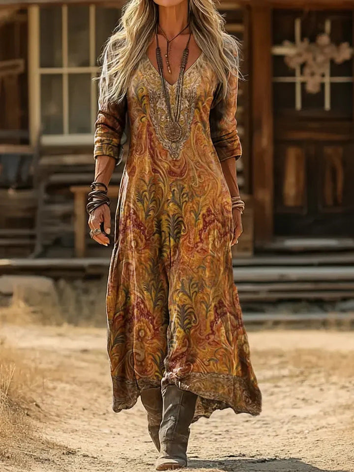 Marissa paisley maxi dress, detail of ornate V-neckline and uneven hem